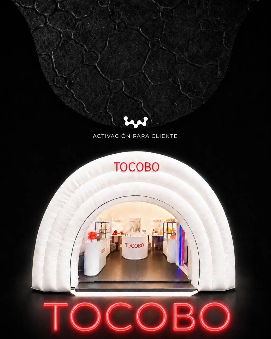Pop-up inflable en arco de TOCOBO con letrero de neón